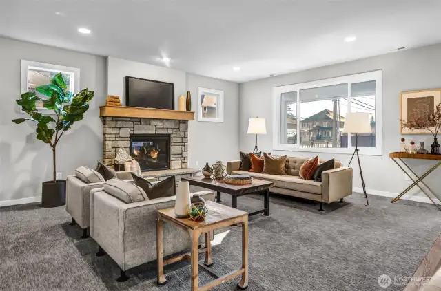 Family room with gas fireplace. Pictures depict a previously built home similar to the home going to be built on this lot. Floor plans, Elevations, colors, upgrades & materials may be different.