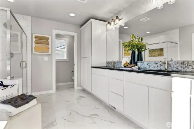 Primary bathroom with attached large closet. Pictures depict a previously built home similar to the home going to be built on this lot. Floor plans, Elevations, colors, upgrades & materials may be different.