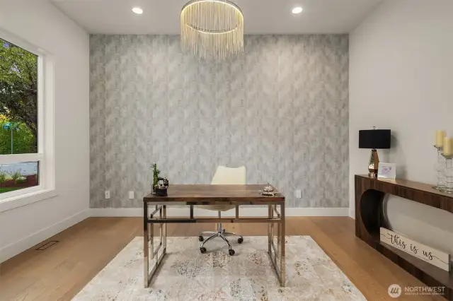 Stylish Den with Clear Glass Double Doors. Designer Wallpaper & a Statement Chandelier
