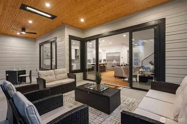12-Foot, Four-Panel Sliding Glass Door Opens to the Patio, Creating a Seamless Indoor-Outdoor  Living Experience