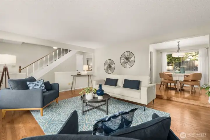 Living room looking towards the dining room and stairway to upper level
