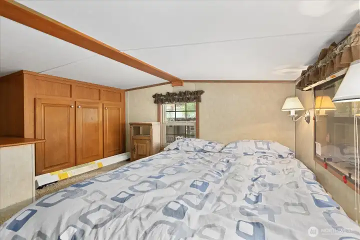 Loft space with storage and sleeping space.