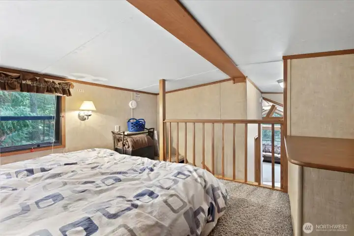 Loft space with storage and sleeping space.