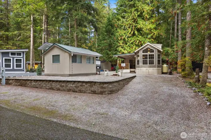 Plenty of parking. Fire pit area, shed/gazebo building, park model with add a room and covered deck. What more do you need? With the Glen At Maple Falls amenities included you should have all you could need in a recreational property.