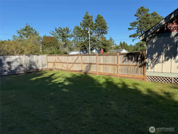 The fence  shown here on the east side,  has a large gate that opens for your convenience.