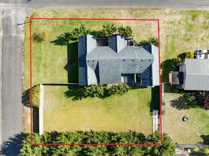 Double lot with fenced back yard.