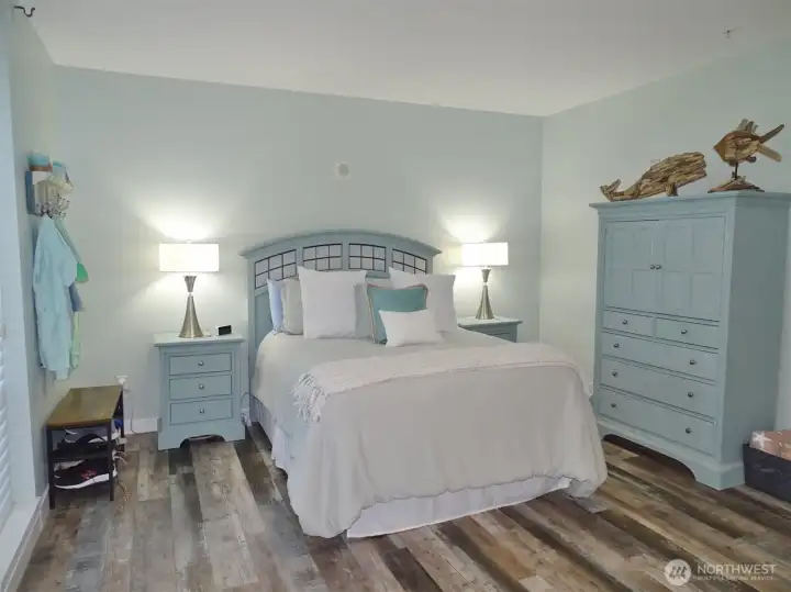 Open Bedroom w/ classy furnishings.