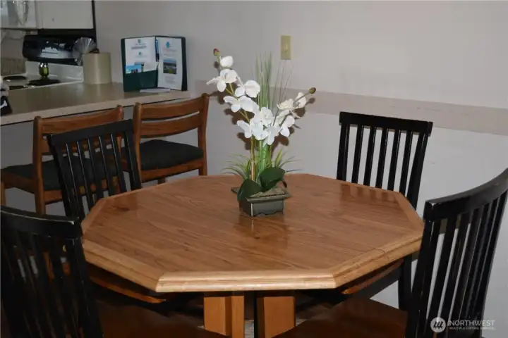 Dining area with more seating at the kitchen bar.