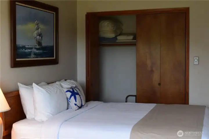 Closet stores extra blankets & pillows.