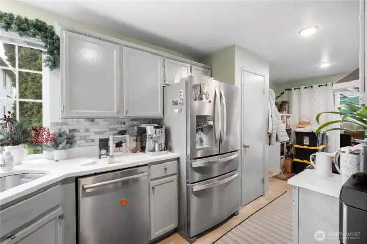 The Kitchen boasts stainless steel appliances and plenty of cabinets, quartz countertops, and a pantry.