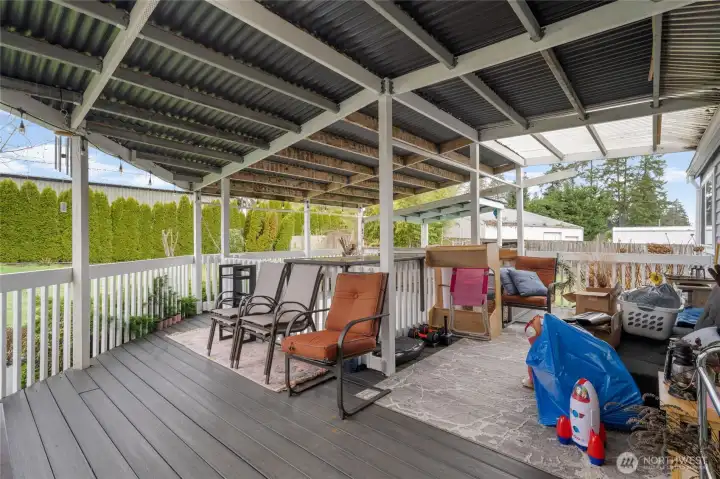 Covered deck area is massive! Water pond (not currently in use) is in the background of the covered area.