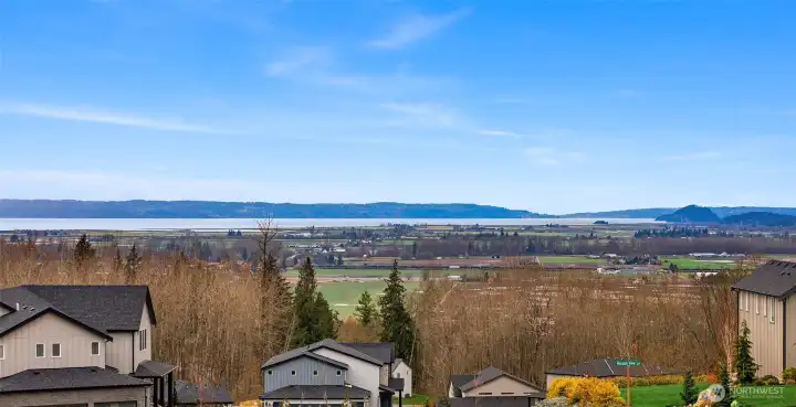 This is the view from the top of the hill looking west.  The lot does not have a Saltwater View.  It has a partial Lake View.