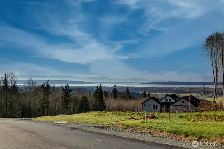 This is the view from the top of the hill looking west.  The lot does not have a Saltwater View.  It has a partial Lake View.