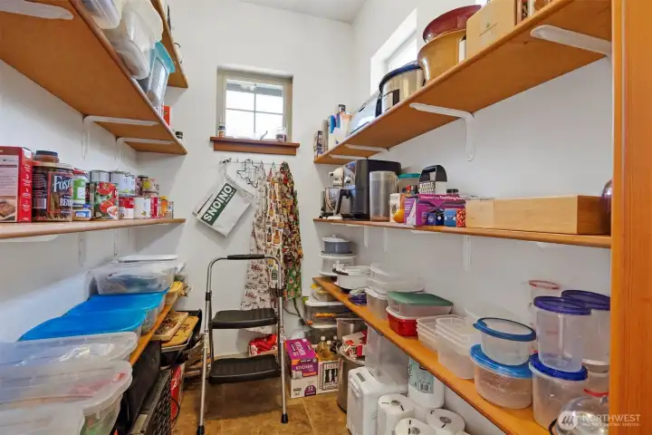 There is a large, walk-in pantry adjacent to the kitchen.
