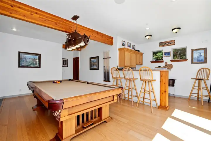 The pool room has a wet bar and and is ideal for entertaining.