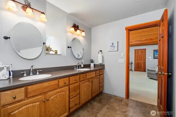 The primary bath has a very spacious dual sink vanity.