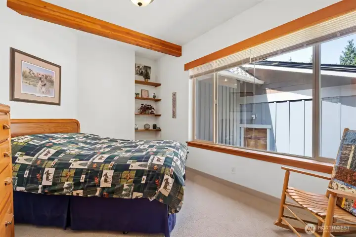 The second bedroom is on the main floor just off the pool room area.