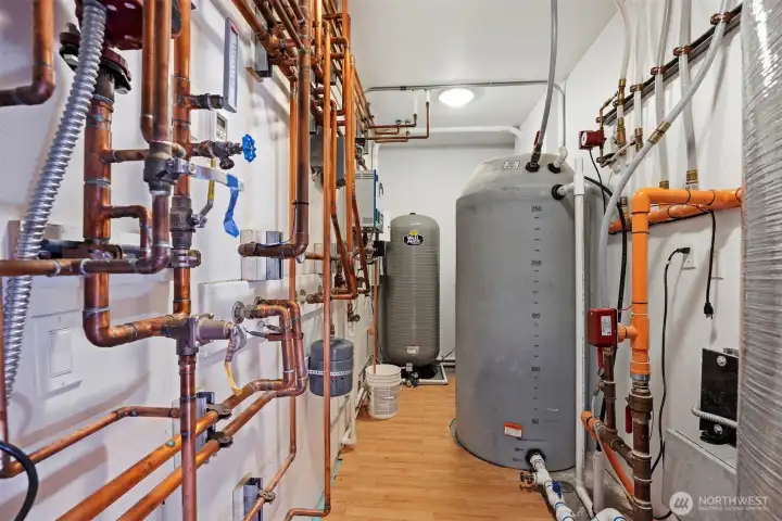 The mechanical room is very large and handles the radiant heat and well tanks.