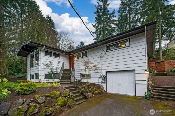 Front of house with rock wall