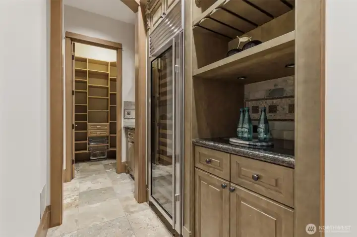 Just off the kitchen, and with easy access to the dining area is a butler's pantry, wine fridge and large walk-in pantry.