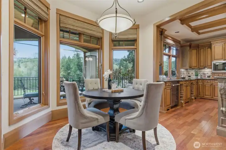 The kitchen nook overlooks the Golf Course. Not shown to the left is access to the main floor covered terrace - a wonderful spot to linger of an evening.