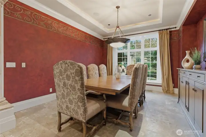 The dining room features hand-applied Venetian plaster on the walls. This old-world technique adds depth, texture and a rich, formal ambiance. The table and dresser were custom built for the and will remain - because in a house like this the furniture is the architecture.