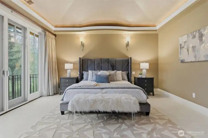 Upstairs the primary is separated from other bedrooms. It's luxurious, private with stunning vistas of the golf course below. There's a balcony overlooking the course below - a wonderful space to enjoy coffee!