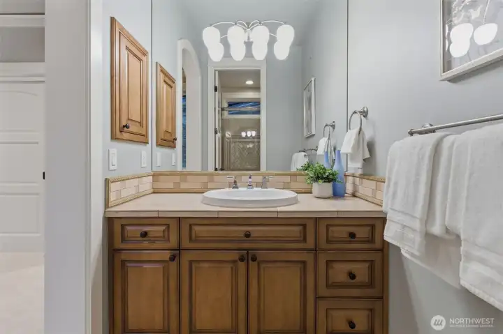 Jack and Jill in style, both of the South Wing bathrooms have their own vanity but share a full bath.