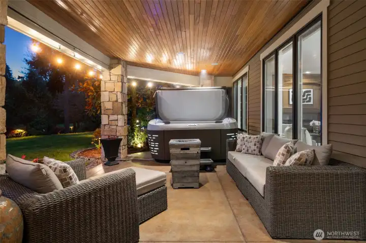 The lower level terrace is completely weatherproof and features a 6 person hot tub, and a built in gas fireplace (not shown)