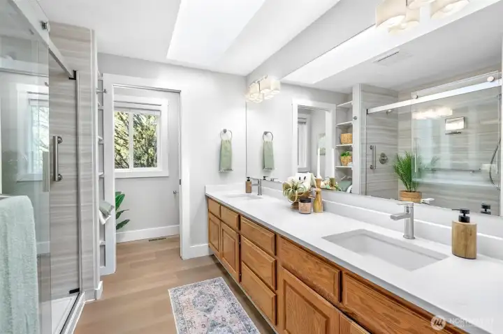 Primary bathroom with double vanity and updated shower.