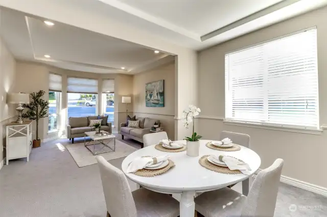 The living room and dining room create a large open space.