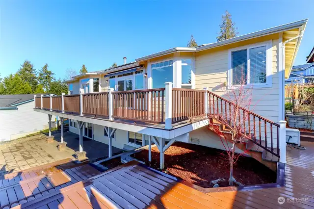 The back deck and lower patio celebrate the view from every level.