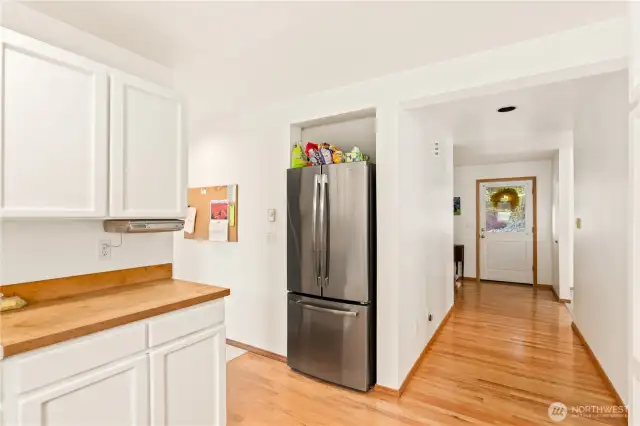 Sparkling wood floors shine with abundant natural light pouring in year-round.