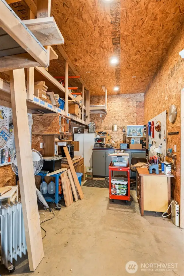 This room is already set up for woodworking, plenty of storage and counter space, great spot for your hobby interests