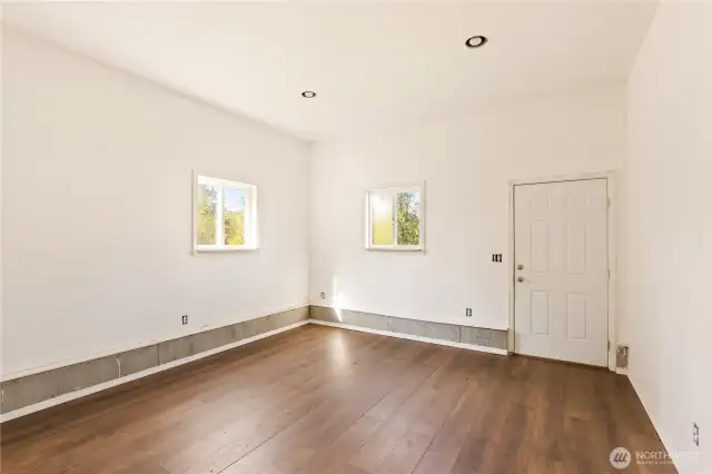 Finished room on the ground level of the shop, with separate entry.  Private space for guests, yoga studio, workout space?