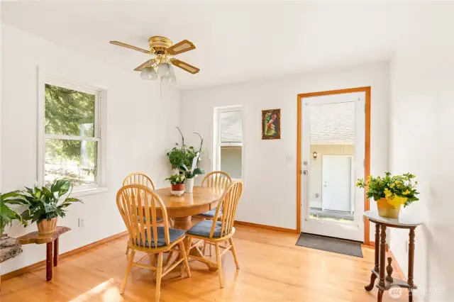 Feel the warmth of the summer sun in this charming dining area.