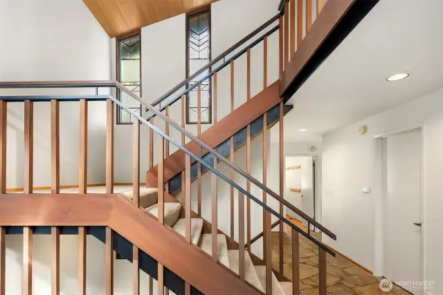 Warm wood staircases highlight the Northwest Contemporary vibe.