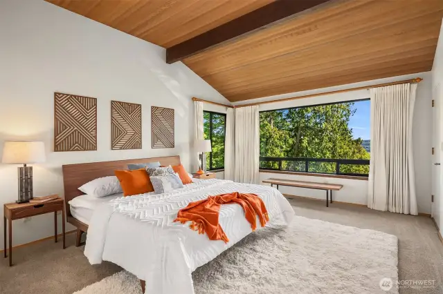 Your vaulted primary suite is a true retreat.