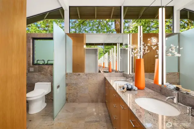 Spa-like primary bath dressed in granite (including heated floors for toasty toes!)