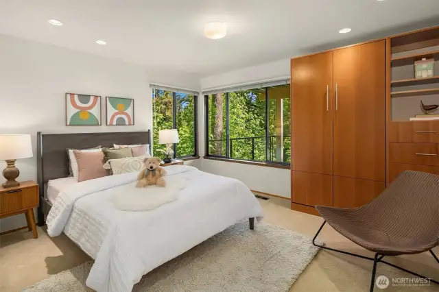 Generous 3rd bedroom with wrap-around windows & more custom built-ins with a Murphy bed!