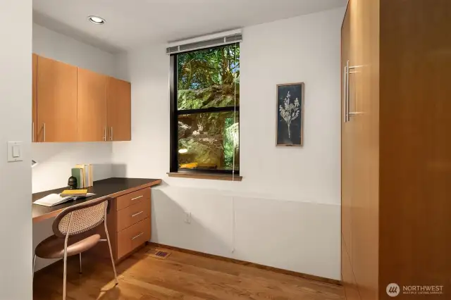 The 4th bedroom includes a built-in desk and Murphy bed & can double as your office or hobby room.