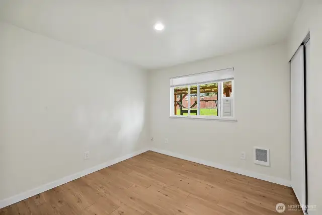 This flexible bedroom space invites your creativity—make it a restful retreat, inspiring home office, or playful guest room.