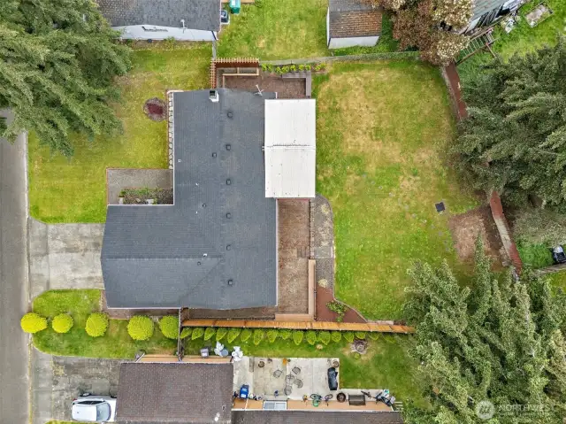 A bird’s eye view highlights the thoughtful lot layout, expansive backyard, and patio space—an ideal setting for summer gatherings or quiet evenings at home.