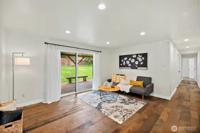 The living room is all about comfort and connection—with sliding doors to the backyard and a cozy setup that invites you to sit down and stay awhile.