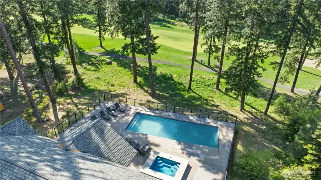 Aerial view of the pool, hot tub and golf course
