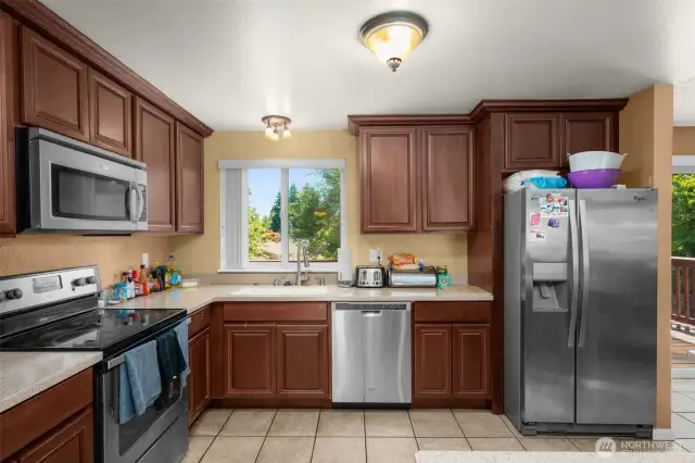 Large L shaped kitchen with tile floors