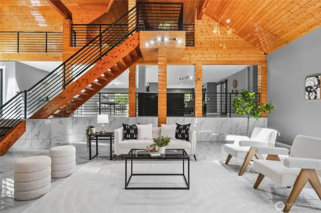 Sleek tile floors greet visitors in the HUGE living room with bar