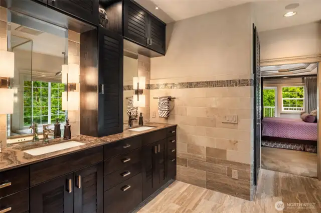Experience the elegance of natural stone walls and floors, complemented by warm heated flooring and a comfort-controlled heated bidet.