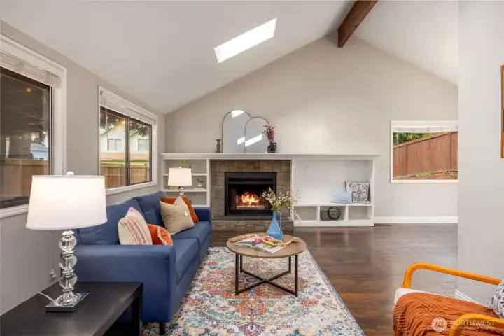 Living room with wood burning fire place and built ins.