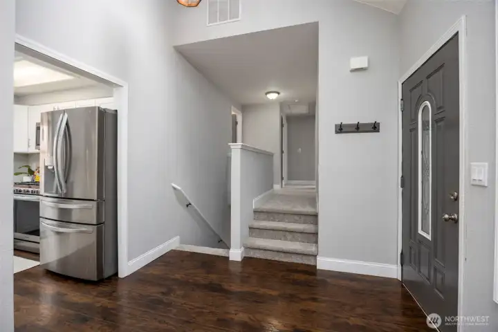 Entry with stairs down to family room, 4th bedroom, laundry room & bath, + garage access! OR take the stairs up to the primary bedroom/bathroom, two additional bedrooms and a full bath.